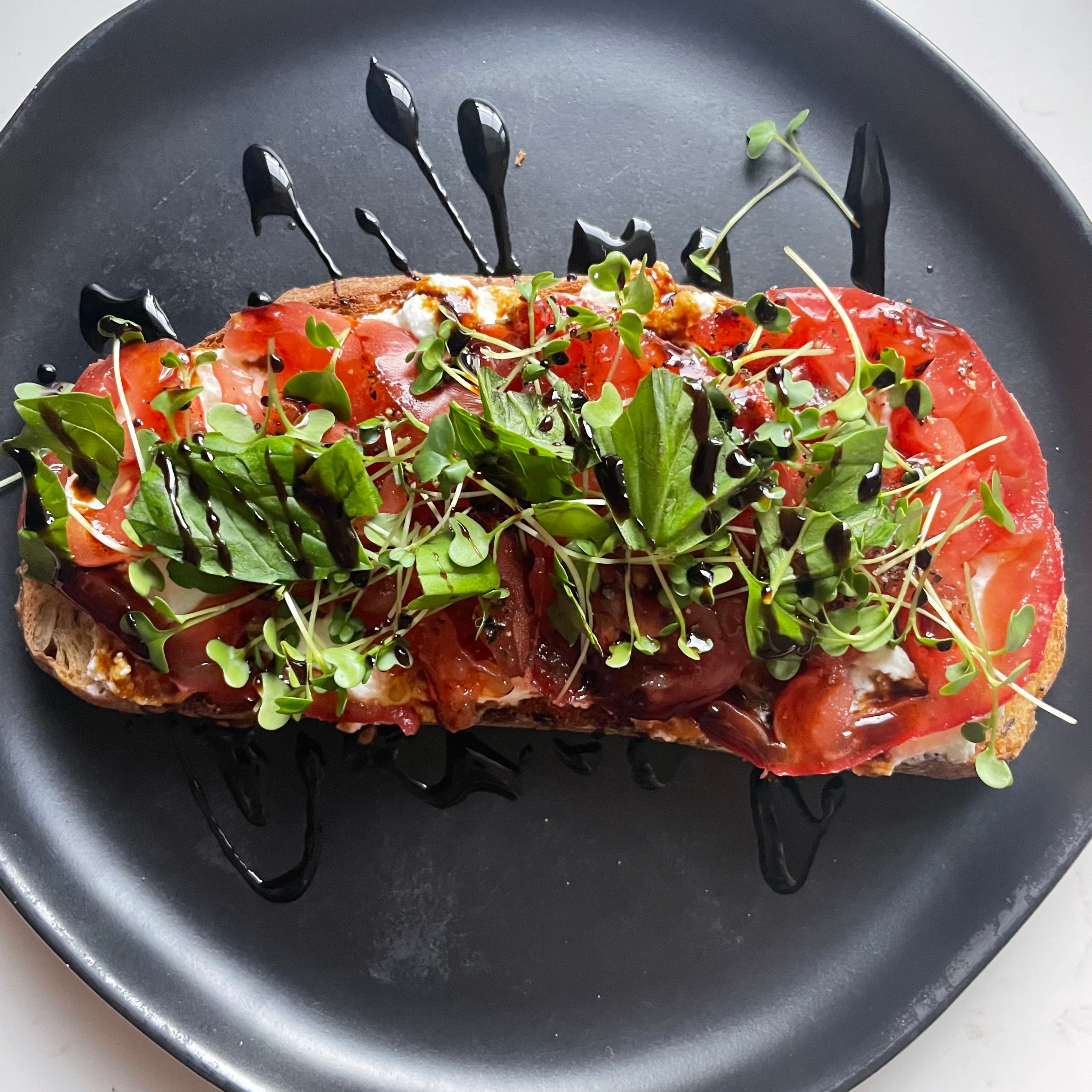 Ricotta and Tomato Toast with Microgreens and Basil